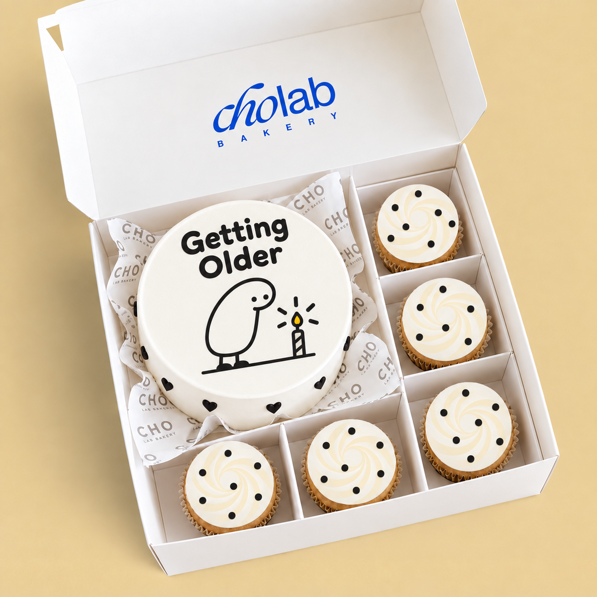 Getting Older — Edible Print — one mini cake and five cupcakes with edible printed artwork