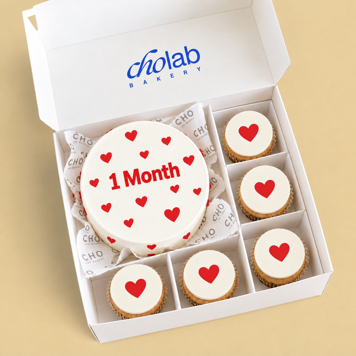 One Month — Edible Print — one mini cake and five cupcakes with edible printed artwork