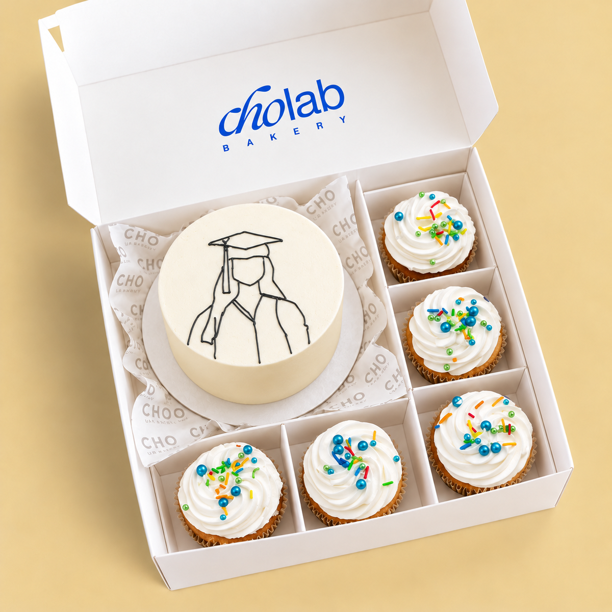 Her Graduation — one mini cake and five matching cupcakes in CHO packaging